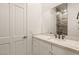 Bright bathroom boasts a vanity with quartz countertop and a walk-in shower at 1725 Bannie Ave, Las Vegas, NV 89102