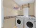 Laundry room with washer, dryer, and shelving at 1931 Sunset Village Cir, Henderson, NV 89014