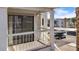 Balcony with sliding glass doors and a view of the parking lot and palm trees at 1940 Las Palmas Ln # 269, Laughlin, NV 89029