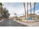 Entrance to Spinnaker Bay community with palm trees and signage at 2160 Camel Mesa Dr, Laughlin, NV 89029