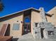 House entrance with arched window, stone fireplace, and glass block at 2205 Alia Ct, Las Vegas, NV 89102