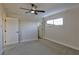 Well-lit bedroom with ceiling fan and access to bathroom at 3225 Crawford St, North Las Vegas, NV 89030