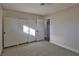 Bedroom with mirrored closet doors and access to a bathroom at 3225 Crawford St, North Las Vegas, NV 89030