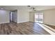 Bright living room with wood-look floors and sliding glass doors leading to backyard at 3225 Crawford St, North Las Vegas, NV 89030