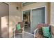 Inviting balcony with wicker chairs and sliding glass doors at 3480 Cactus Shadow St # 101, Las Vegas, NV 89129