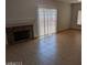 Living room with fireplace and sliding glass doors at 352 Lyon Dr, Henderson, NV 89074