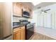 View of the updated kitchen featuring stainless steel appliances and wood grain cabinets at 3550 Bay Sands Dr # 3061, Laughlin, NV 89029