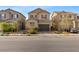 Two-story home with a two-car garage and landscaped front yard at 414 Desert Cadence St, Henderson, NV 89011