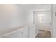 Upstairs hallway with simple, carpeted flooring and neutral decor at 414 Desert Cadence St, Henderson, NV 89011