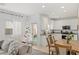 Modern open kitchen and dining area with a Christmas tree at 414 Desert Cadence St, Henderson, NV 89011