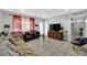 Living area with a couch, two armchairs, an entertainment center, and a glass-top coffee table at 6109 Empire Cir, Las Vegas, NV 89107