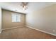 Bedroom featuring neutral walls, carpet, and ceiling fan at 7316 Covington Gardens St, Las Vegas, NV 89131