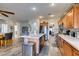 Spacious kitchen with island, stainless steel appliances, and ample cabinetry at 7686 Silent Falls St, Las Vegas, NV 89123