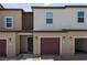 Two story townhome with attached garage and landscaped yard at 7941 Whisper Words Ave, Las Vegas, NV 89113