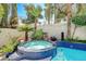 Relaxing spa with cascading water feature and tropical plants at 8145 Bay Harbor Dr, Las Vegas, NV 89128