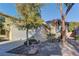 Front exterior view of a single-story home with attached garage and landscaping at 8904 Martin Downs Pl, Las Vegas, NV 89131