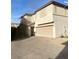 Two-story house with attached garage and driveway at 9144 Starling Wing Pl, Las Vegas, NV 89143