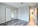 Bedroom with mirrored closet doors and wood-look flooring at 2900 Matterhorn Way, Las Vegas, NV 89102