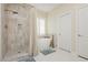 Modern bathroom with a walk-in shower, free standing tub and neutral tile at 3112 Madame Plantier Ave, North Las Vegas, NV 89081