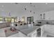 Modern kitchen with a large island, stainless steel appliances, and white cabinets at 3208 Calle De El Cortez, Las Vegas, NV 89102