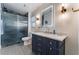 Elegant bathroom with navy vanity and marble countertops at 4339 Pittsfield St, Las Vegas, NV 89115