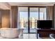 Bathroom with a large soaking tub and city views at 4381 W Flamingo Rd # 3002, Las Vegas, NV 89103