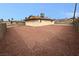 Large backyard with gravel and a concrete patio at 5261 Crater Cir, Las Vegas, NV 89122