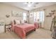 Bright bedroom featuring a queen bed and decorative artwork at 5504 Emerald Basin St, North Las Vegas, NV 89031