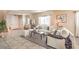 Living room featuring neutral furniture, tile floors, and a view of the entryway at 5504 Emerald Basin St, North Las Vegas, NV 89031