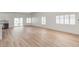 Living room with light wood flooring and view into kitchen area at 5604 Island Breeze Ct, Las Vegas, NV 89130