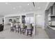 Modern kitchen island with four barstools, open to living area at 667 Palisade Rim Dr, Henderson, NV 89012