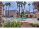 Relaxing community pool with plenty of lounge chairs at 6875 Tamarus St # 103, Las Vegas, NV 89119