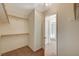 Spacious walk-in closet with built-in shelves at 7328 Wandering St, Las Vegas, NV 89131