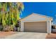 Single-story home with attached two-car garage and desert landscaping at 7328 Wandering St, Las Vegas, NV 89131