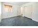 Bright bedroom featuring a window, closet, and neutral wall tones at 7630 Stetson Bluff Ave, Las Vegas, NV 89113