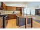 Kitchen features island with granite countertop at 7630 Stetson Bluff Ave, Las Vegas, NV 89113