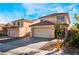 Two-story house with tan exterior, tile roof, and attached garage at 8317 Sky Canyon Ct, Las Vegas, NV 89128