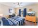 Bedroom with a full bed, dresser, and a flat screen TV at 8455 W Sahara Ave # 287, Las Vegas, NV 89117