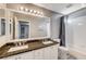 Bathroom boasts double sinks, granite countertop, and a shower/tub combo at 10146 Robins Hollow Rd, Las Vegas, NV 89183