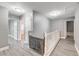 Upstairs hallway with doors to bedrooms and a -safety gate at 10146 Robins Hollow Rd, Las Vegas, NV 89183