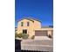 Two-story house with brown garage door and solar panels at 1063 Admiral Emblem St, Henderson, NV 89015