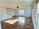 Living room with hardwood floors and staircase at 1063 Admiral Emblem St, Henderson, NV 89015