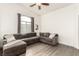 Relaxing living room featuring a large sectional sofa and hardwood floors at 1081 Pleasure Ln # 1, Henderson, NV 89002