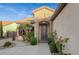 Inviting entryway with wrought iron gate, landscaping, and stone accents at 2094 Sawtooth Mountain Dr, Henderson, NV 89044