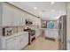 Modern kitchen featuring white cabinets, stainless steel appliances, and ample counter space at 2094 Sawtooth Mountain Dr, Henderson, NV 89044