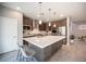 Modern kitchen with stainless steel appliances and large island at 23 Cresta Villa Ct, Henderson, NV 89011