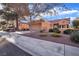 House exterior showcasing a two-car garage and well-maintained landscaping at 2505 Showcase Dr, Las Vegas, NV 89134