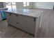 Large kitchen island with marble countertop and gray cabinets at 260 E Keystone Ave, Pahrump, NV 89048