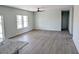 Bright living room with gray flooring and ceiling fan at 260 E Keystone Ave, Pahrump, NV 89048