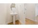 Small powder room with pedestal sink and modern fixtures at 2682 Evolutionary Ln, Las Vegas, NV 89138